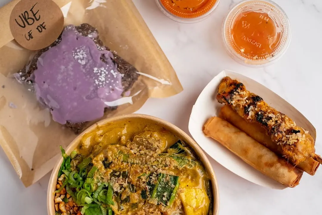 Kare-kare bowl with ube brownie and lumpia spread