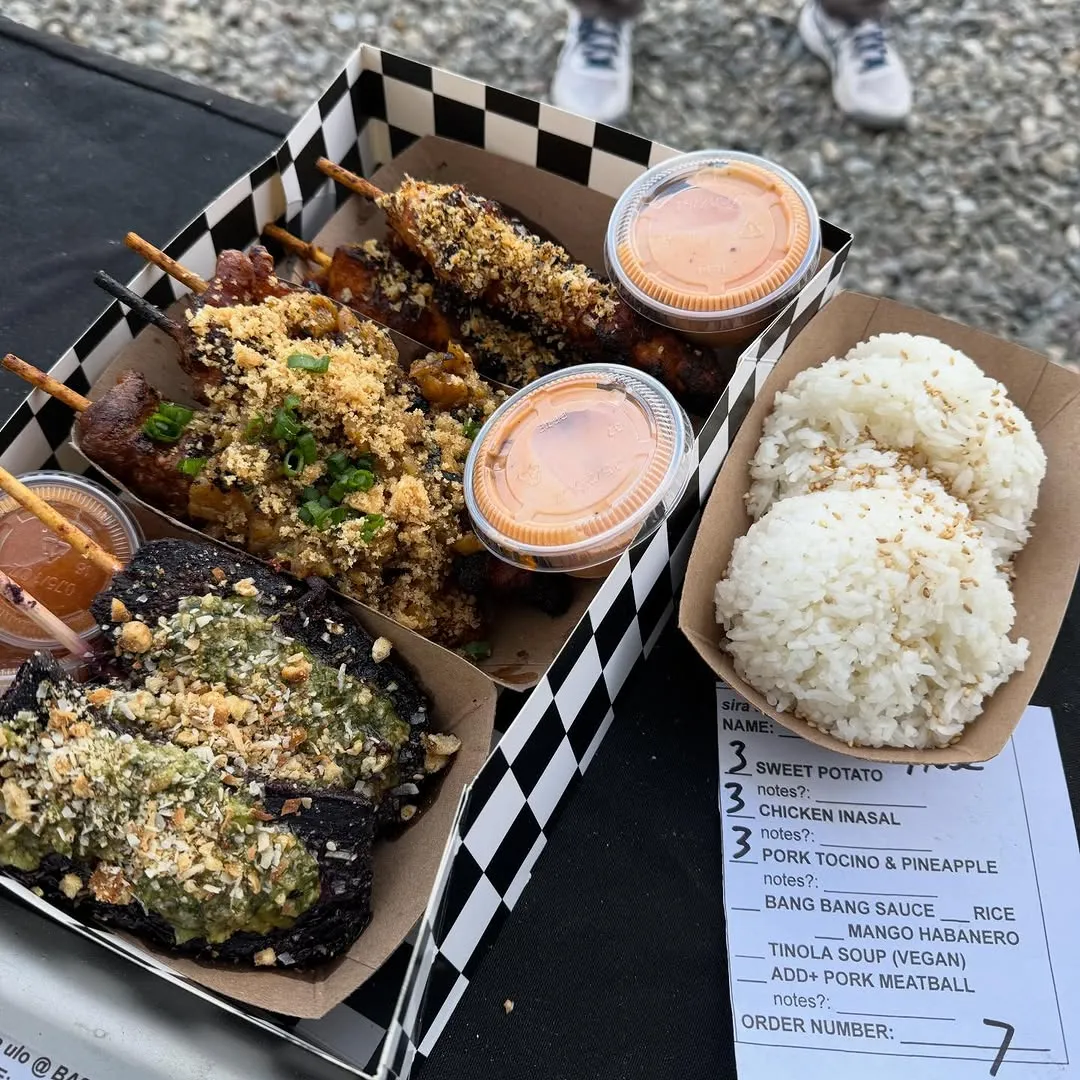 Grilled skewers lined up on the counter at Basilica