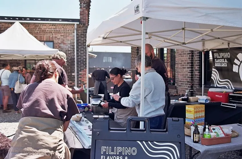 Serving customers at a Sira Ulo outdoor pop-up